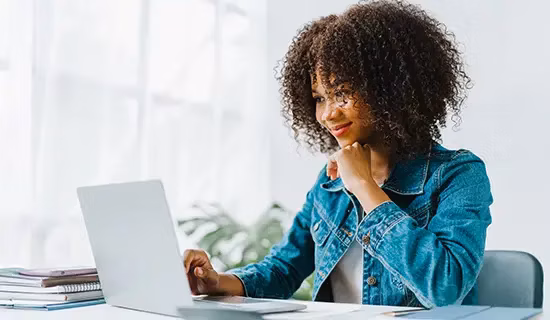A persona using a laptop